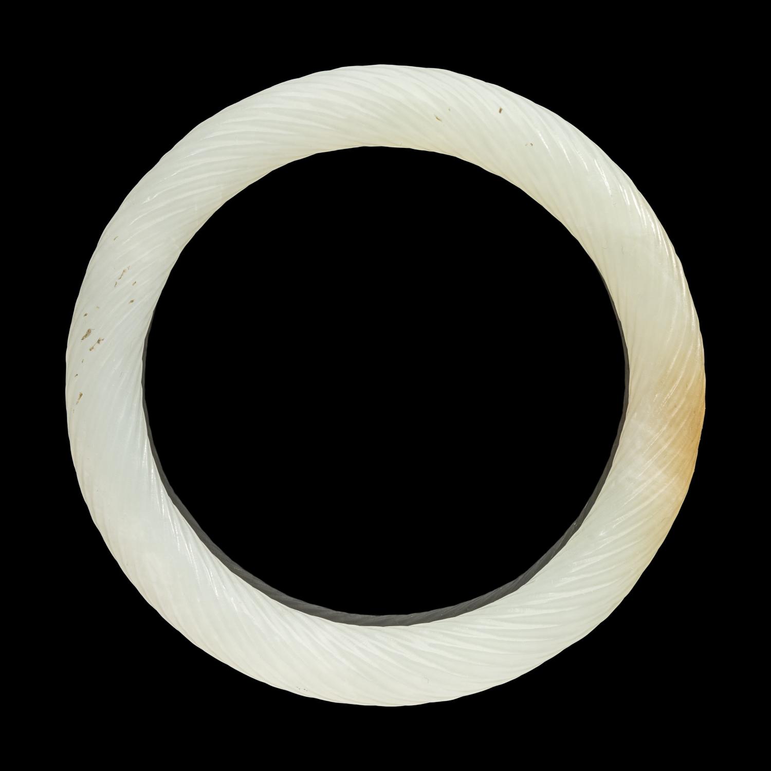 A Chinese Carved Jade Bangle