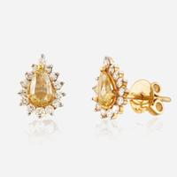 A pair of colored diamond, diamond, and gold earrings