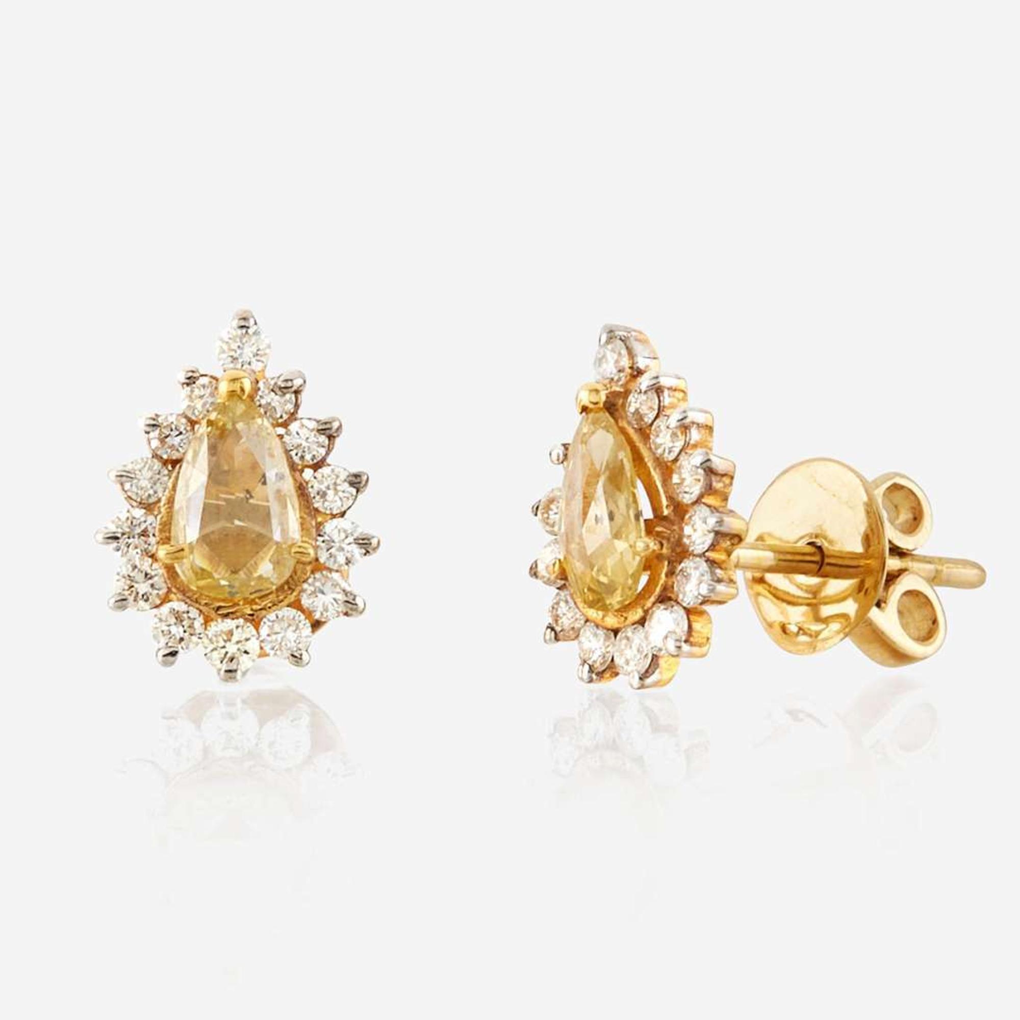 A pair of colored diamond, diamond, and gold earrings