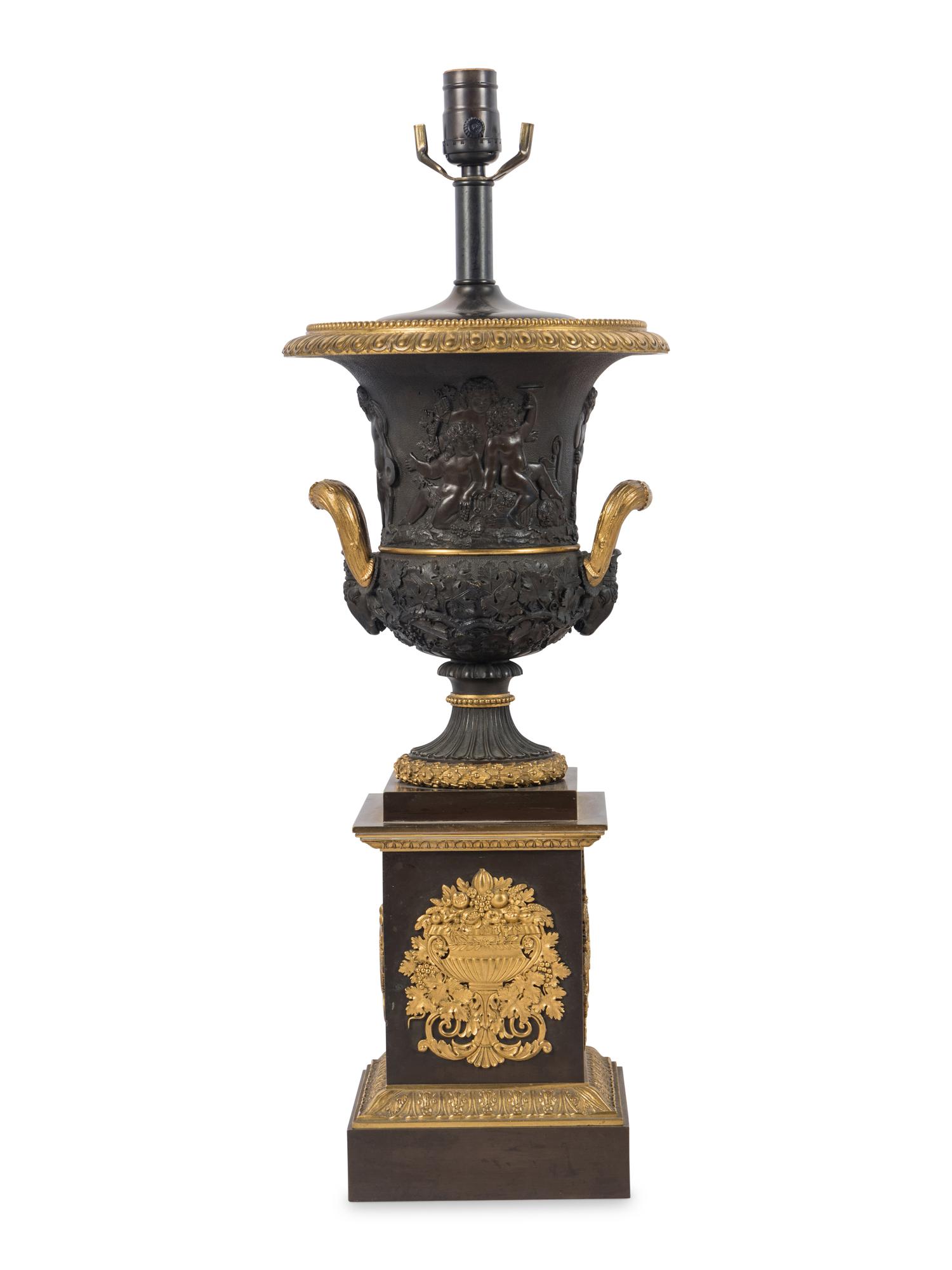 A Pair of Louis Phillippe Parcel-Gilt and Patinated Bronze Urns Mounted as Lamps