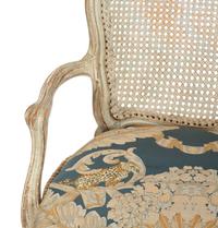 A Pair of Louis XV Blue Painted Cane-Backed Fauteuils