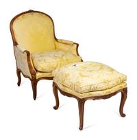 A Louis XV Style Carved Beechwood Bergère and Ottoman