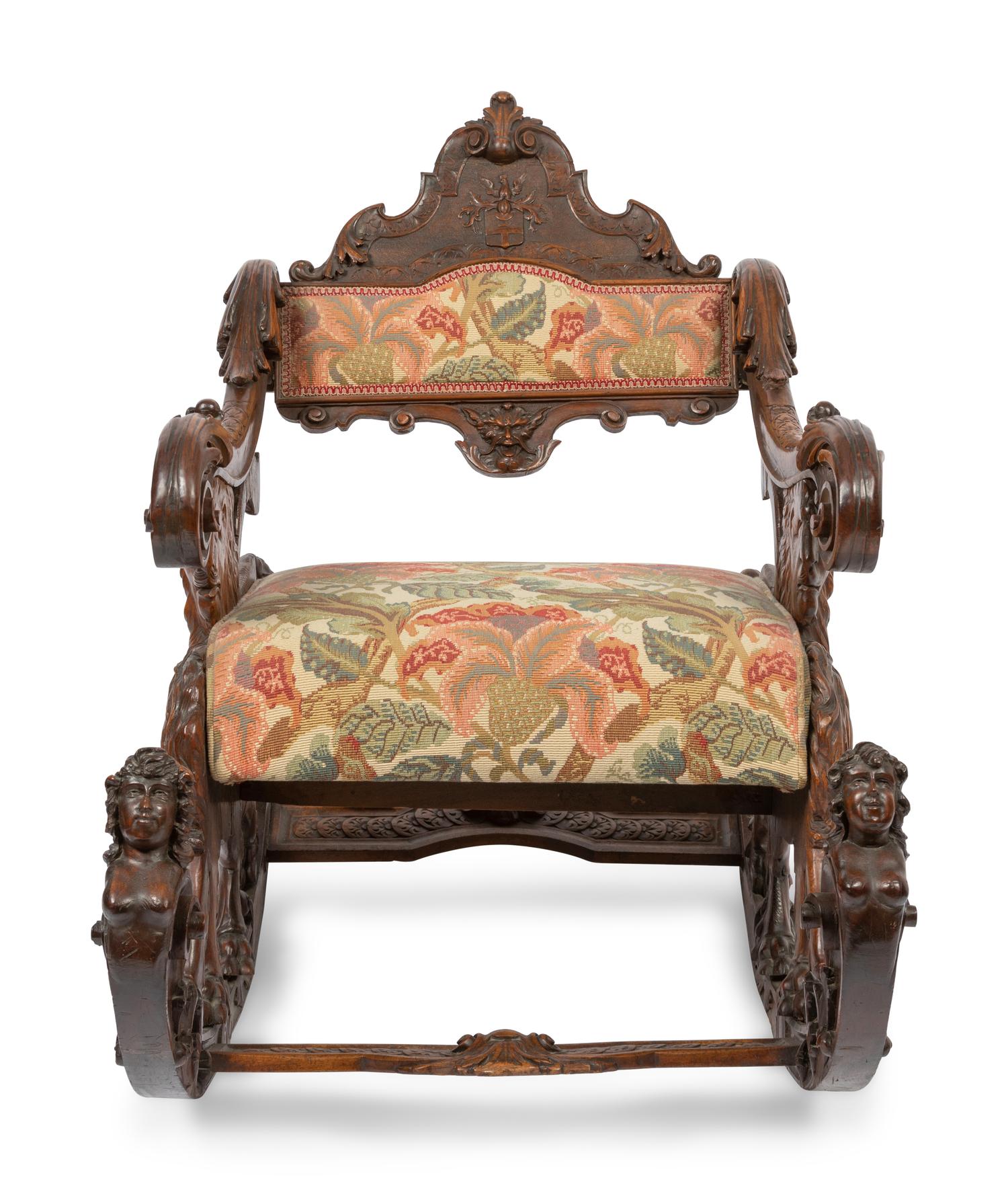 An Italian Carved Walnut Fantasy Rocking Chair