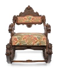 An Italian Carved Walnut Fantasy Rocking Chair