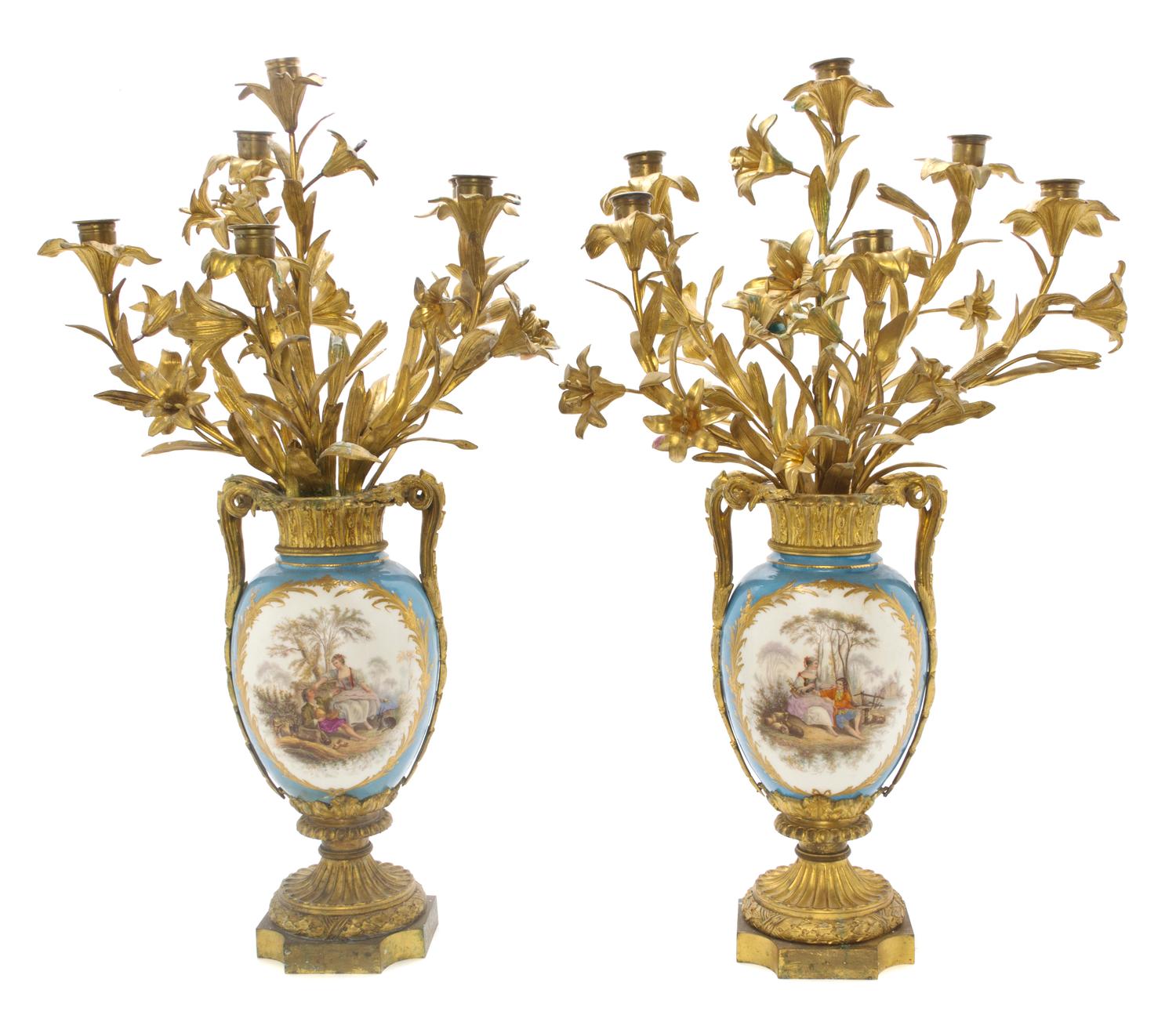 A Pair of Sevres Style Porcelain and Gilt Bronze Mounted Six-Light Candelabra, Height 29 inches.