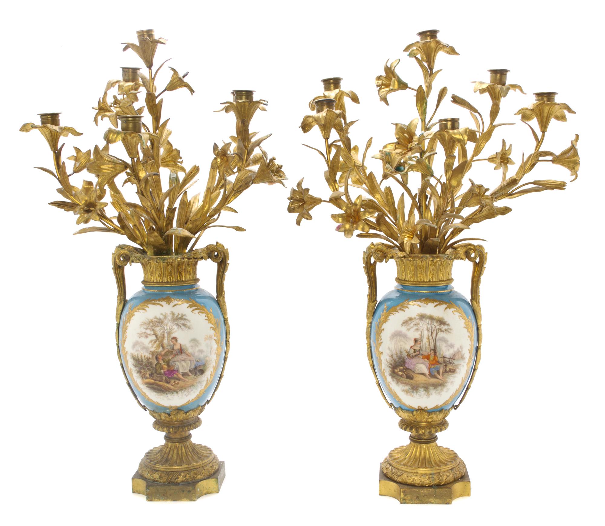 A Pair of Sevres Style Porcelain and Gilt Bronze Mounted Six-Light Candelabra, Height 29 inches.