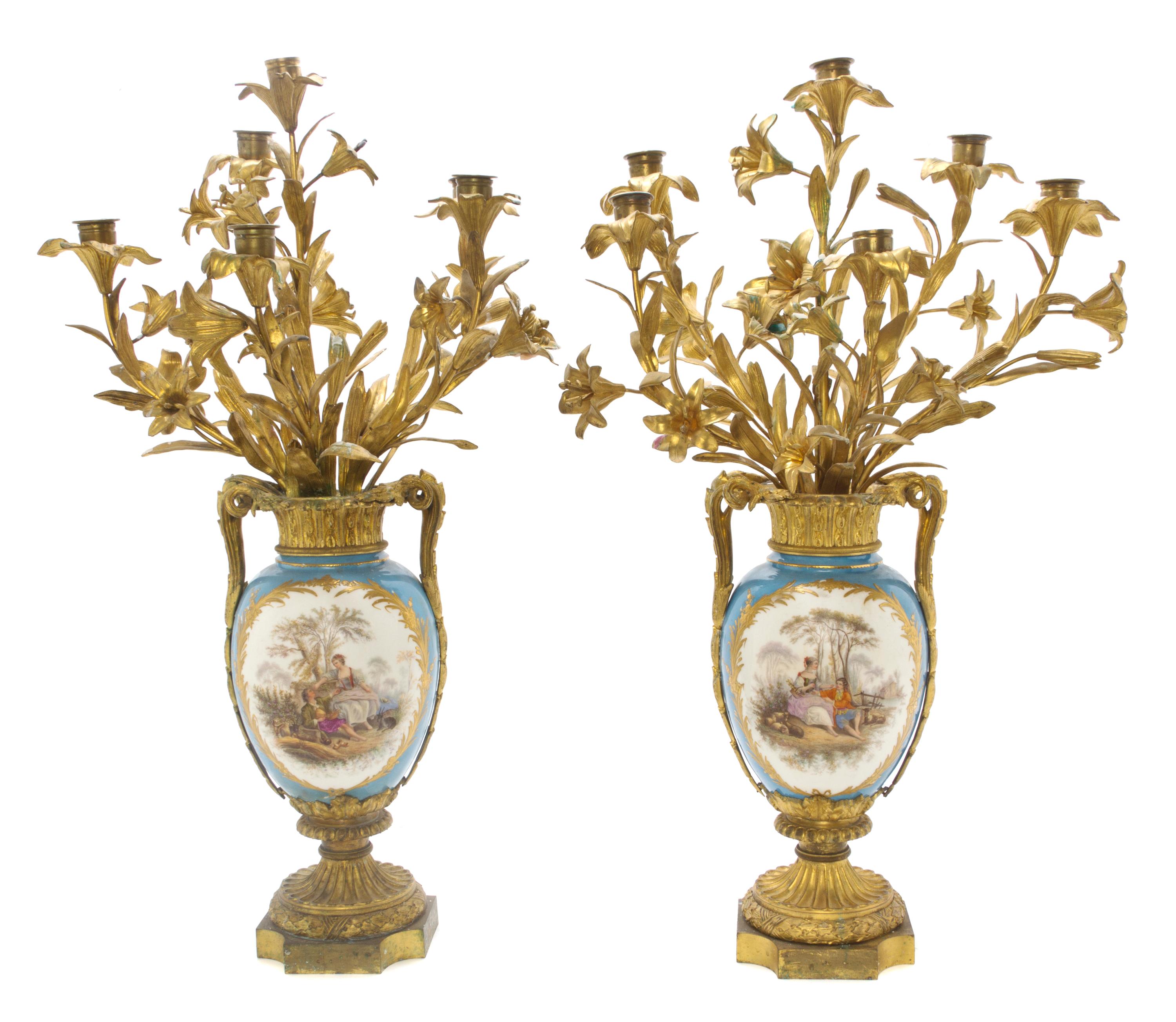 A Pair of Sevres Style Porcelain and Gilt Bronze Mounted Six-Light Candelabra, Height 29 inches.