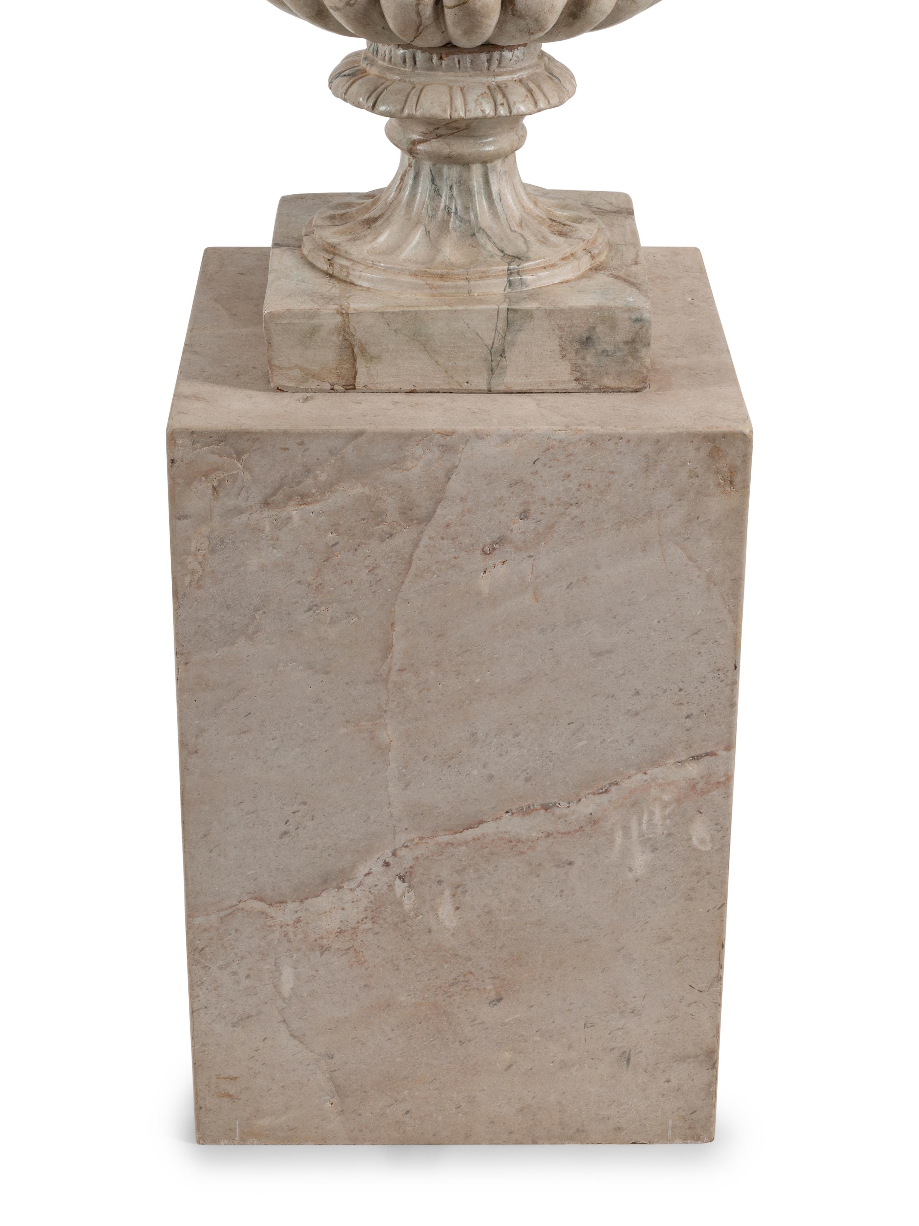 A Pair of Neoclassical Style Faux Marble Painted Terracotta Urns and Stone Plinths