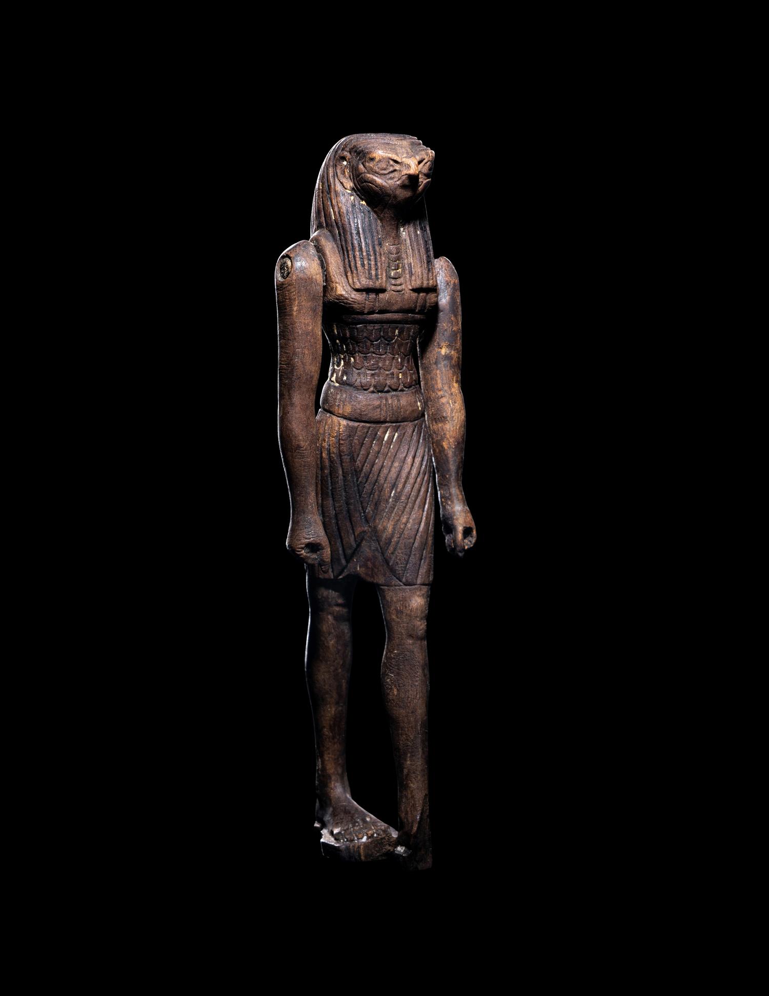 An Egyptian Wood Striding Montu