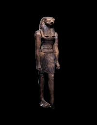 An Egyptian Wood Striding Montu