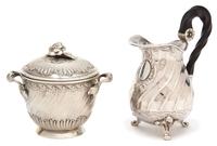 Two French Silver Articles, , comprising a covered two handled jar and a footed creamer with ebonized treen handles.