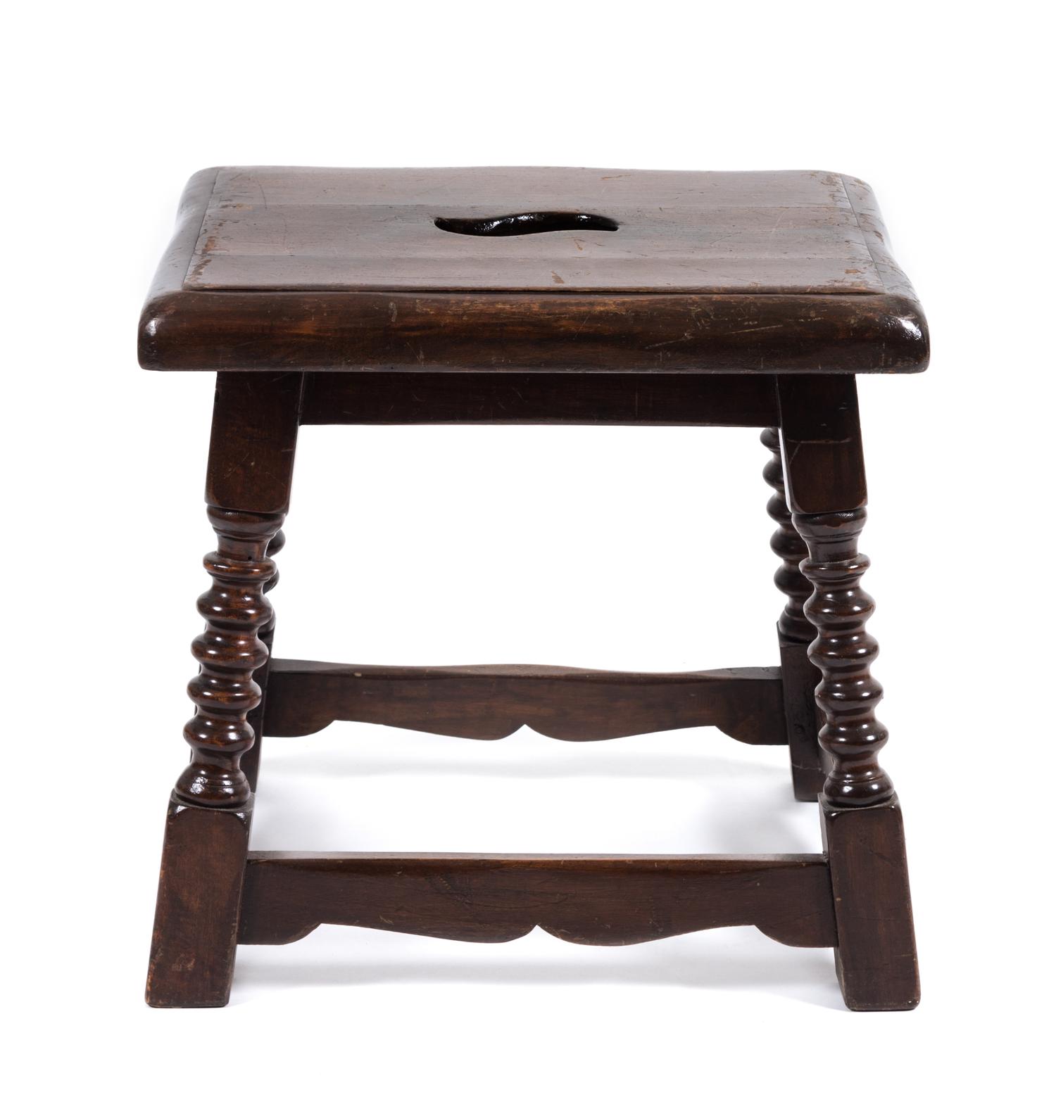A Jacobean Style Walnut Stool Height 17 x width 17 1/2 x depth 14 inches.