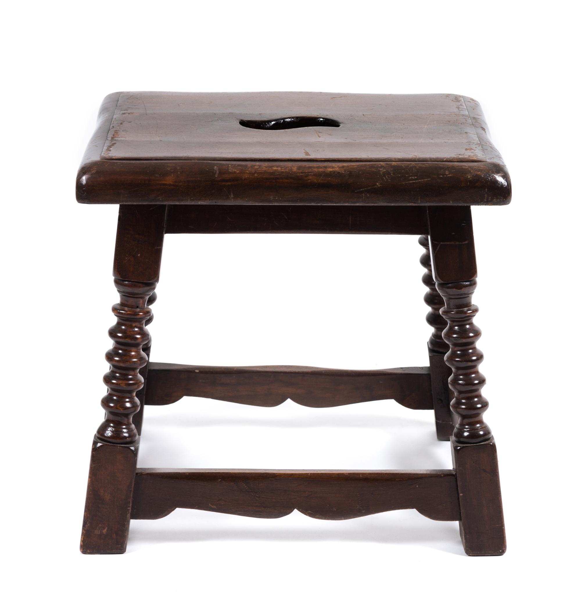 A Jacobean Style Walnut Stool Height 17 x width 17 1/2 x depth 14 inches.