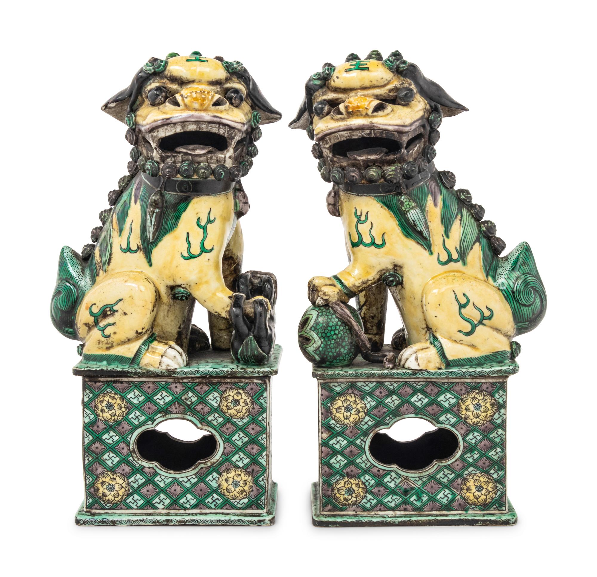 A Pair of Chinese Famille Verte Porcelain Figures of Fu Lions