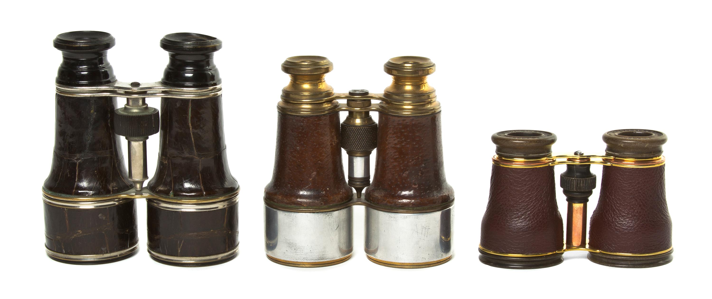 Three Pairs of Leather Veneered Opera Glasses, Width of widest 4 5/8 inches.