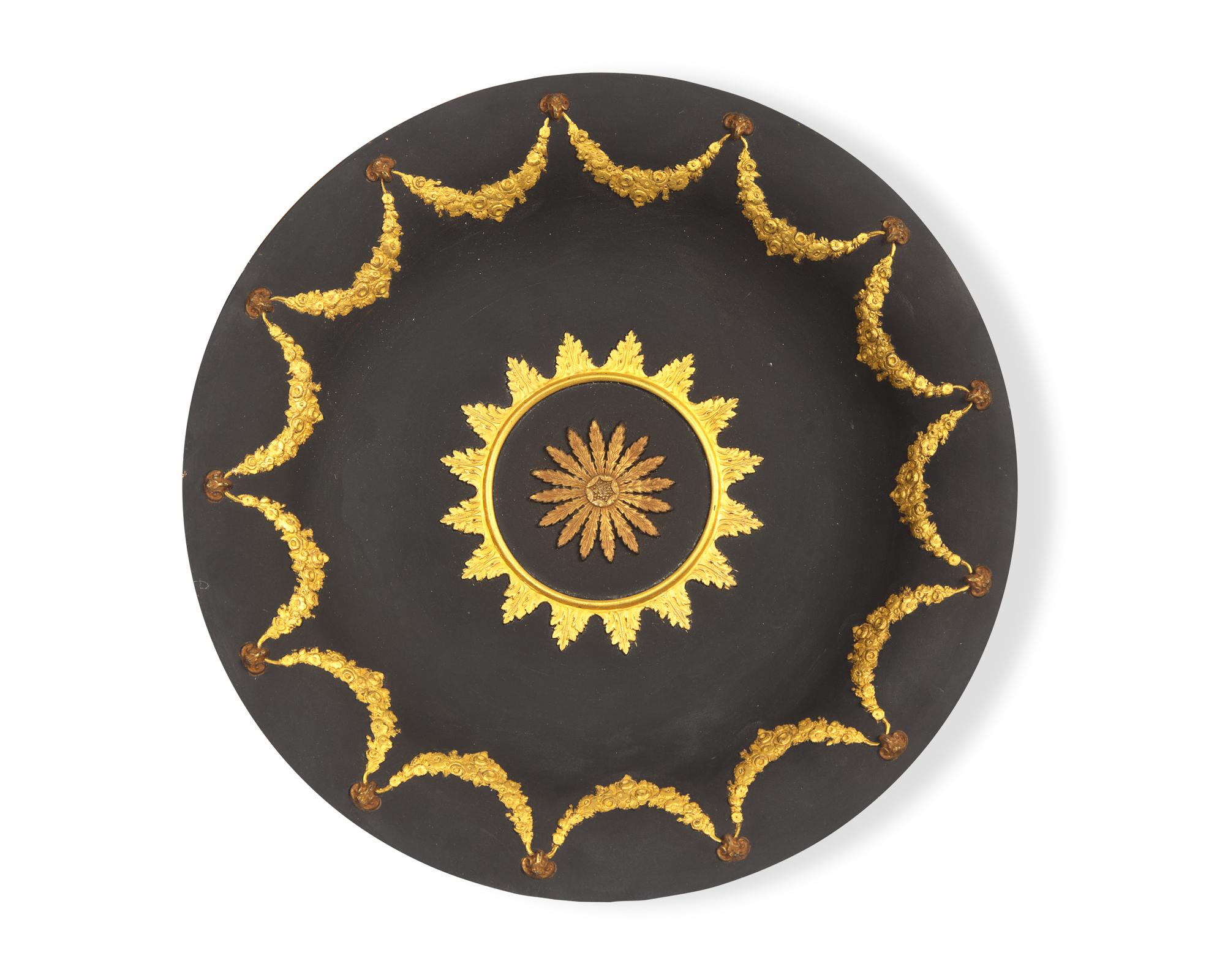 A Wedgwood Neoclassical Parcel-Gilt Black Jasperware Plate