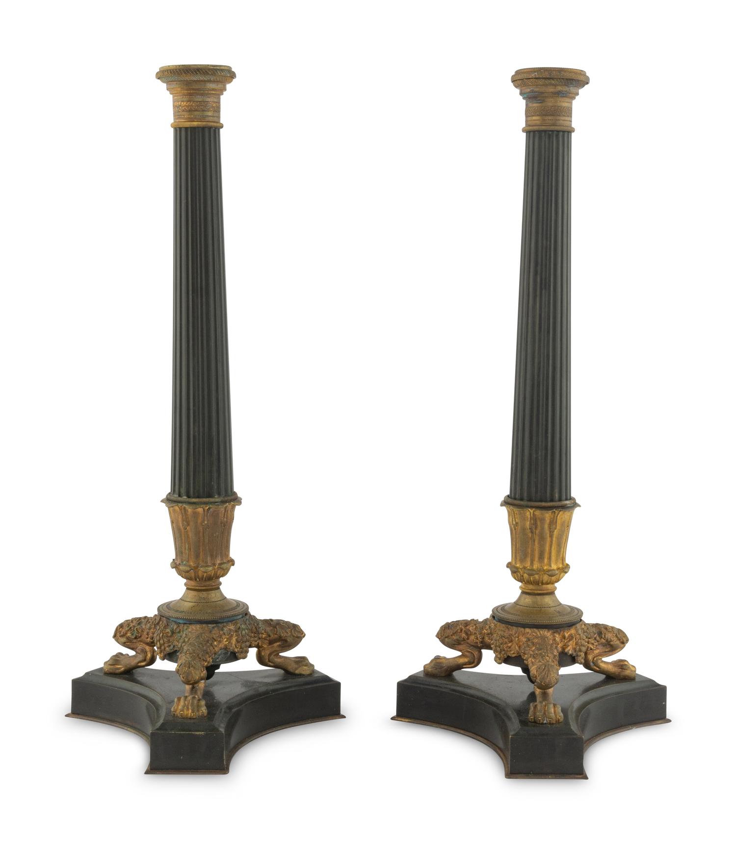A Pair of Charles X Style Patinated and Gilt Bronze Candlesticks