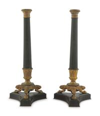 A Pair of Charles X Style Patinated and Gilt Bronze Candlesticks