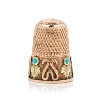 A Bi-Colored Gold and Turquoise Thimble, , the knurled top and body above the foliate and wrigglework decorated band bearing a vacant c