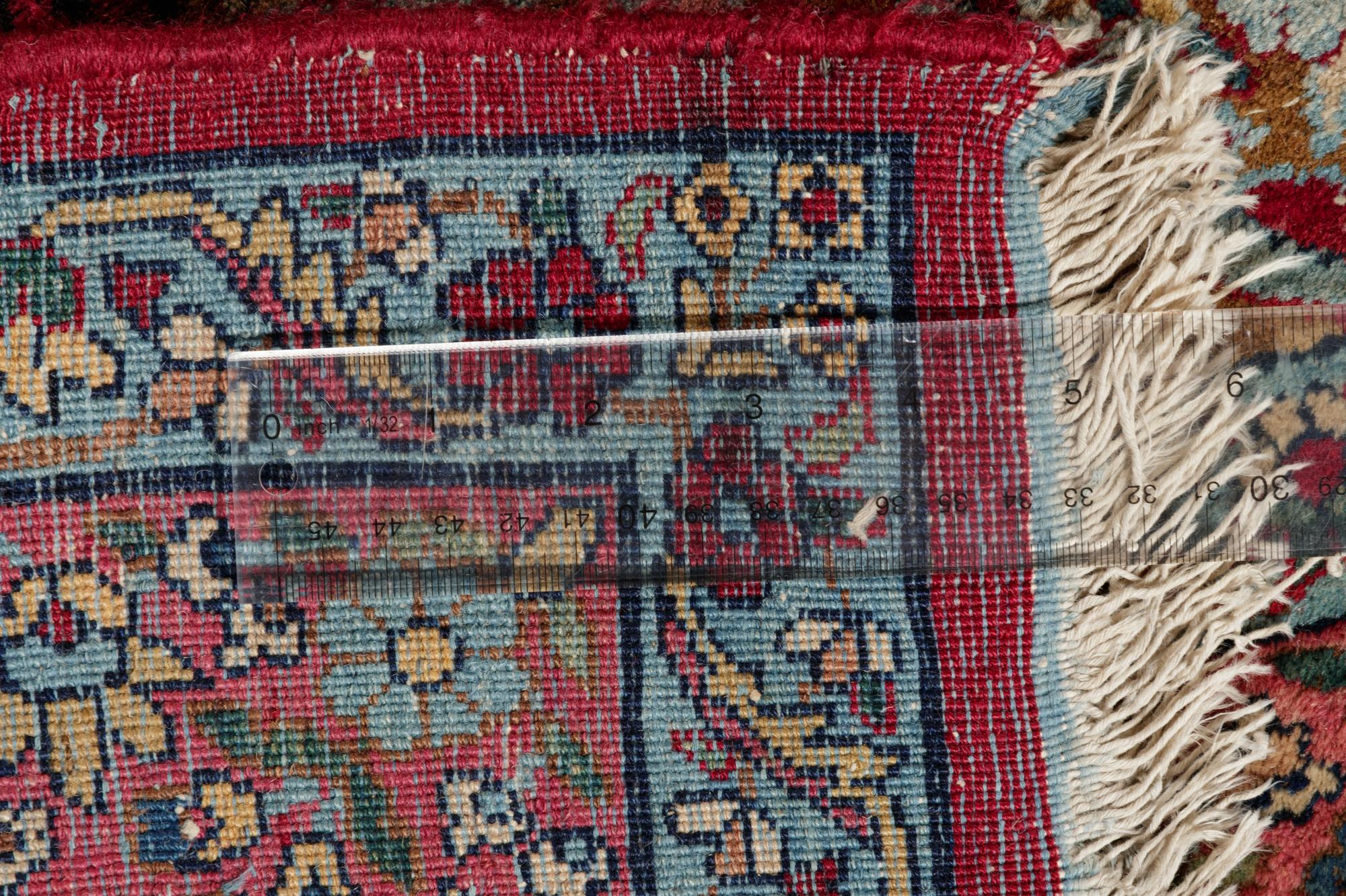 A Kirman Pictorial Wool Rug