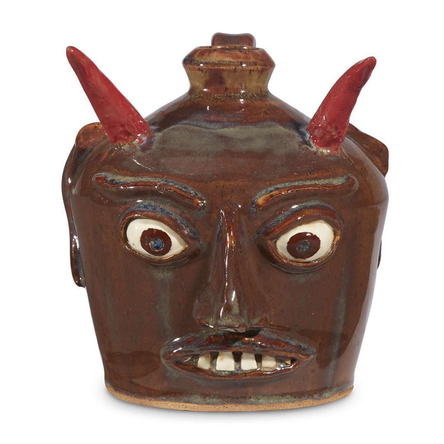 Group of five glazed stoneware face jugs and one figure various artists, Southern States, late 20th century