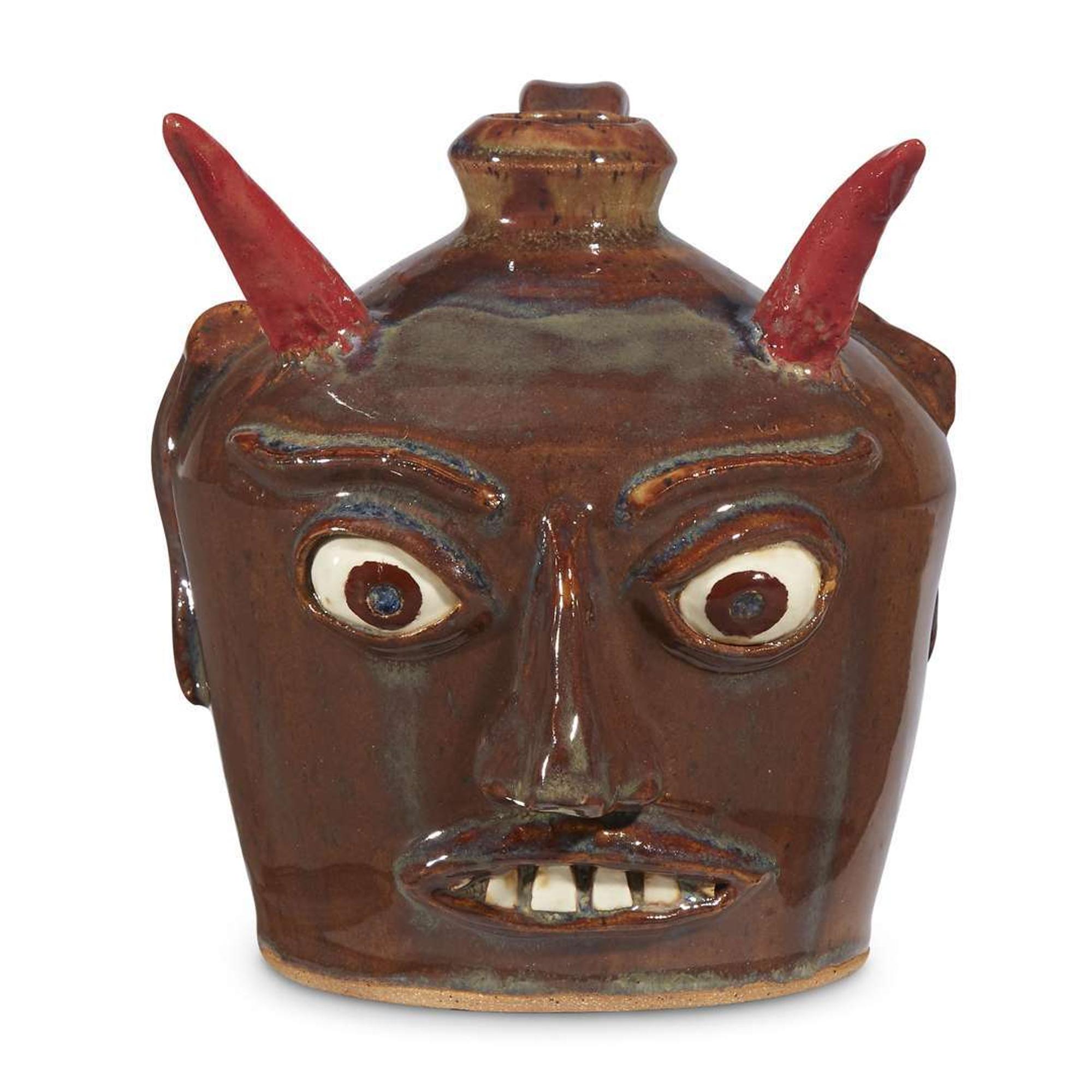 Group of five glazed stoneware face jugs and one figure various artists, Southern States, late 20th century