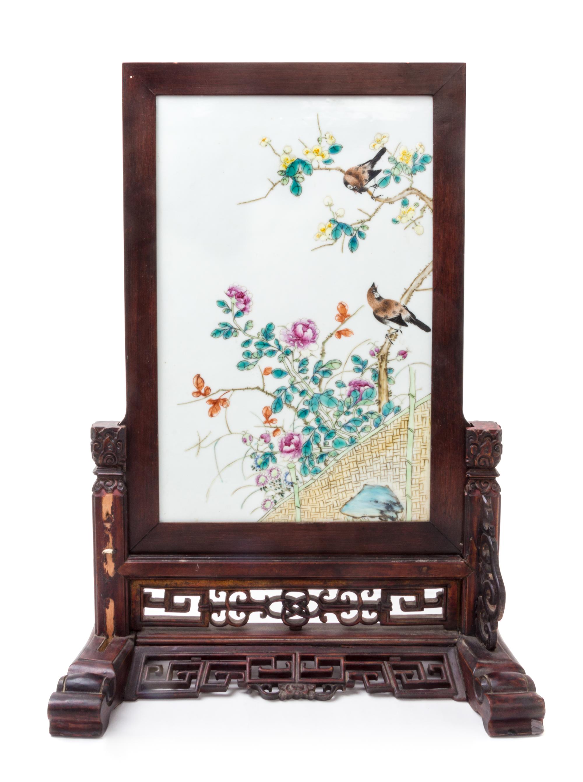 A Famille Rose Porcelain Inset Hardwood Table Screen Height 17 x width 11 1/2 inches.