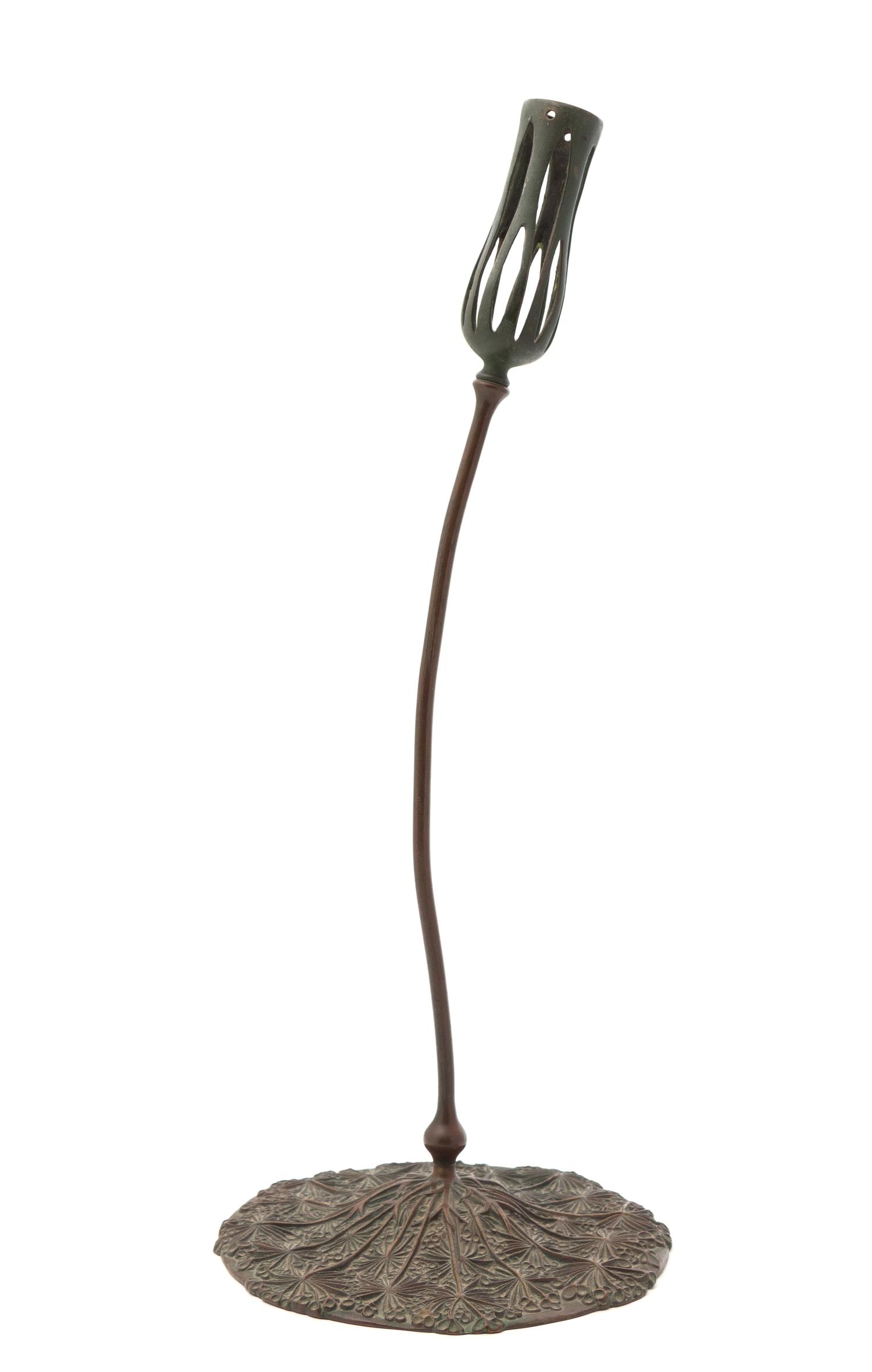 A Tiffany Studios Bronze Candlestick Height 19 3/4 inches.