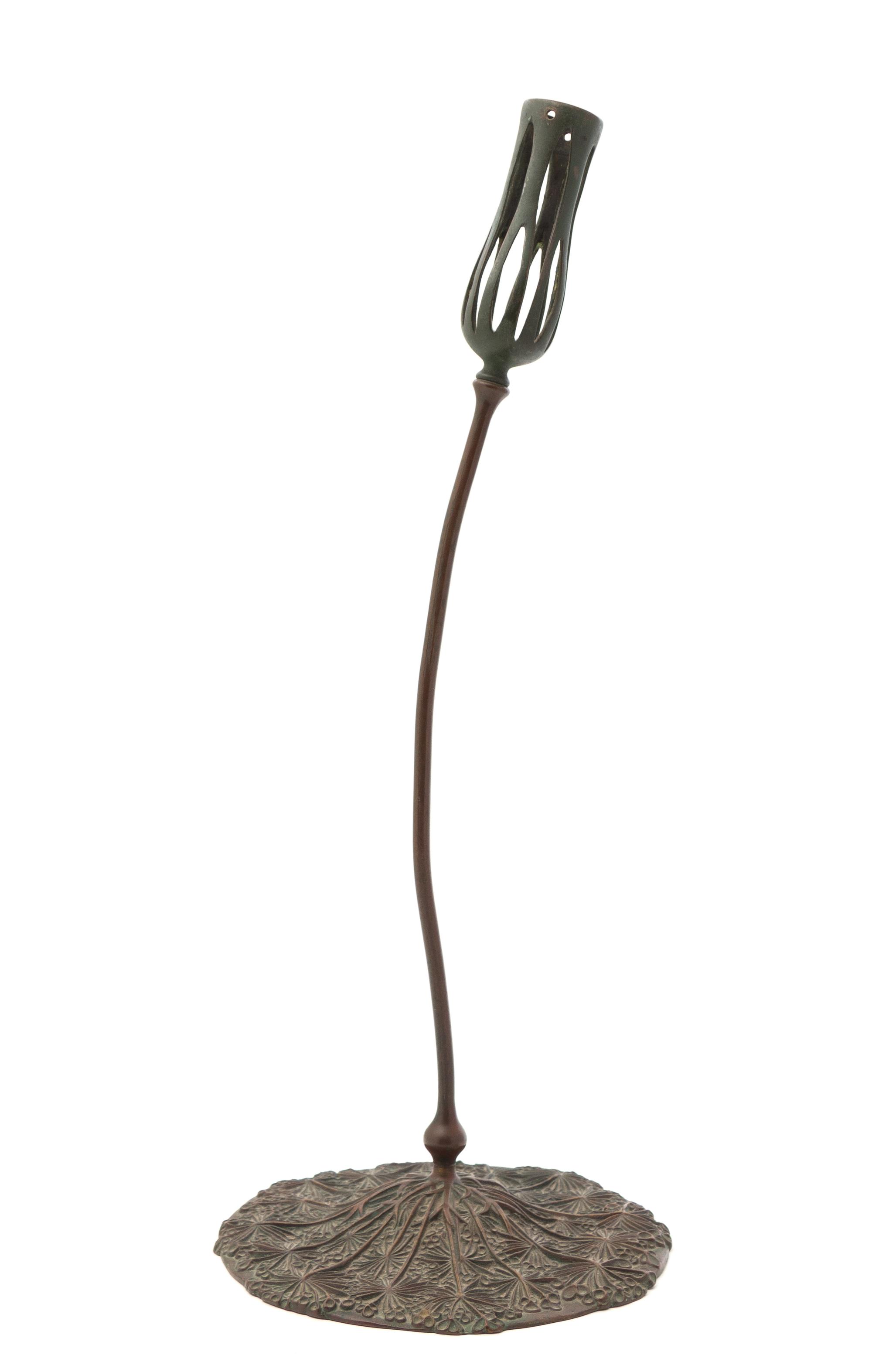 A Tiffany Studios Bronze Candlestick Height 19 3/4 inches.
