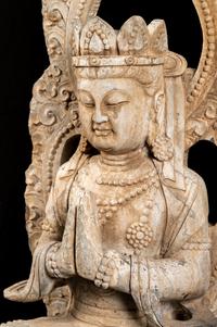 A Chinese Carved Stone Seated Guanyin Figure