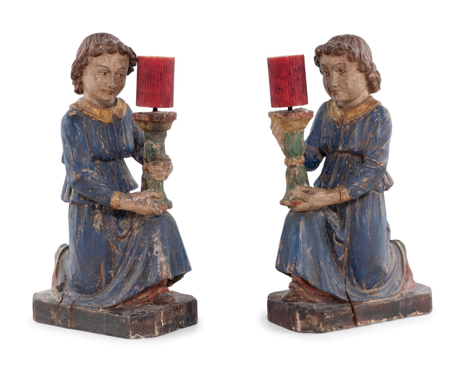 A Pair of Italian Carved and Polychrome Decorated Figural Candlesticks