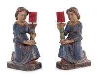 A Pair of Italian Carved and Polychrome Decorated Figural Candlesticks