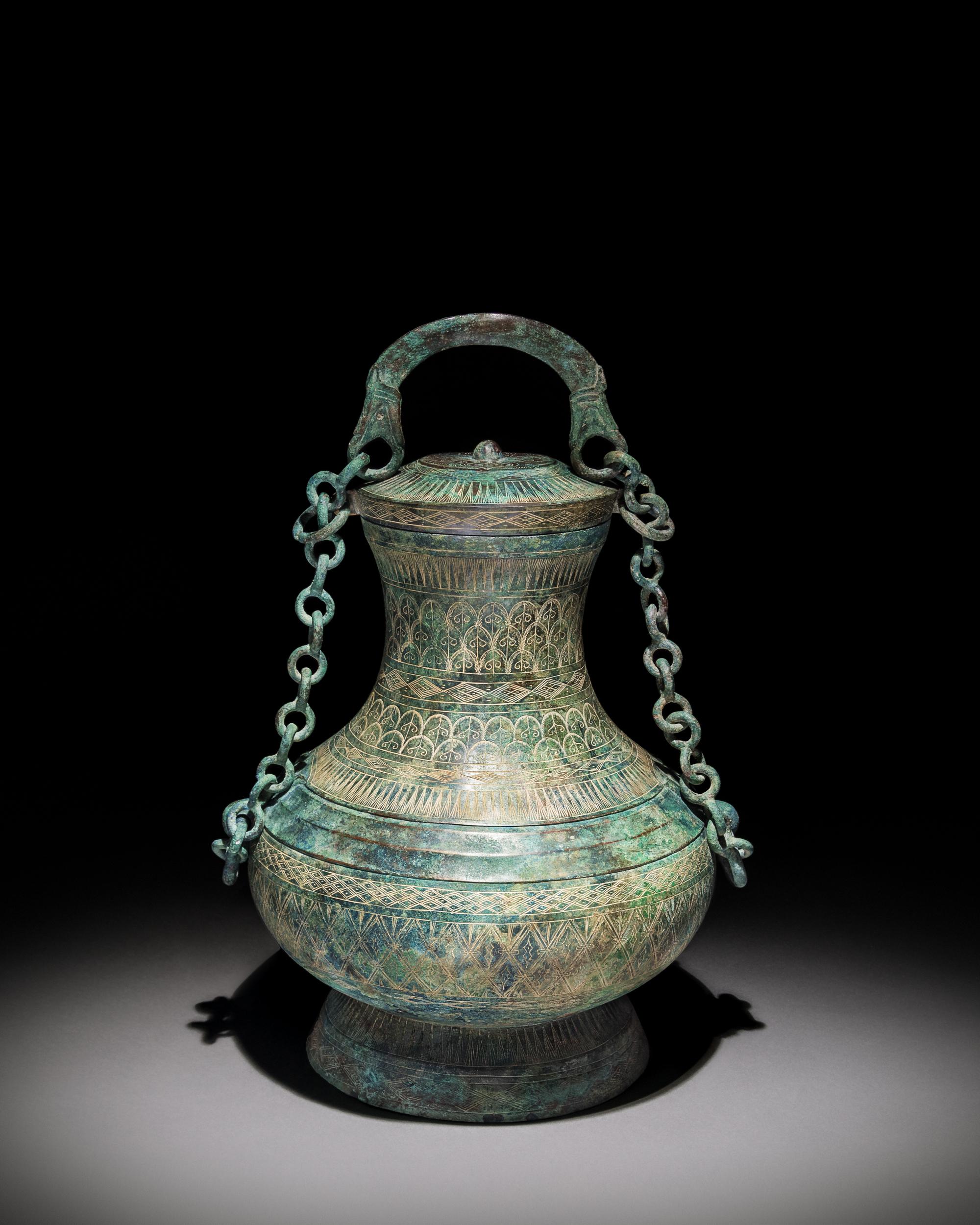 An Archaic Bronze Ritual Wine Vessel, Tilianghu Height 12 1/2 x width 9 1/2 inches. — EASTERN HAN DYNASTY (25-220)