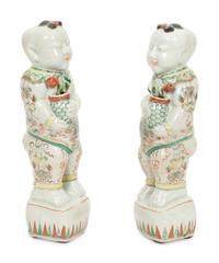 A Pair of Chinese Porcelain Figures of Boys