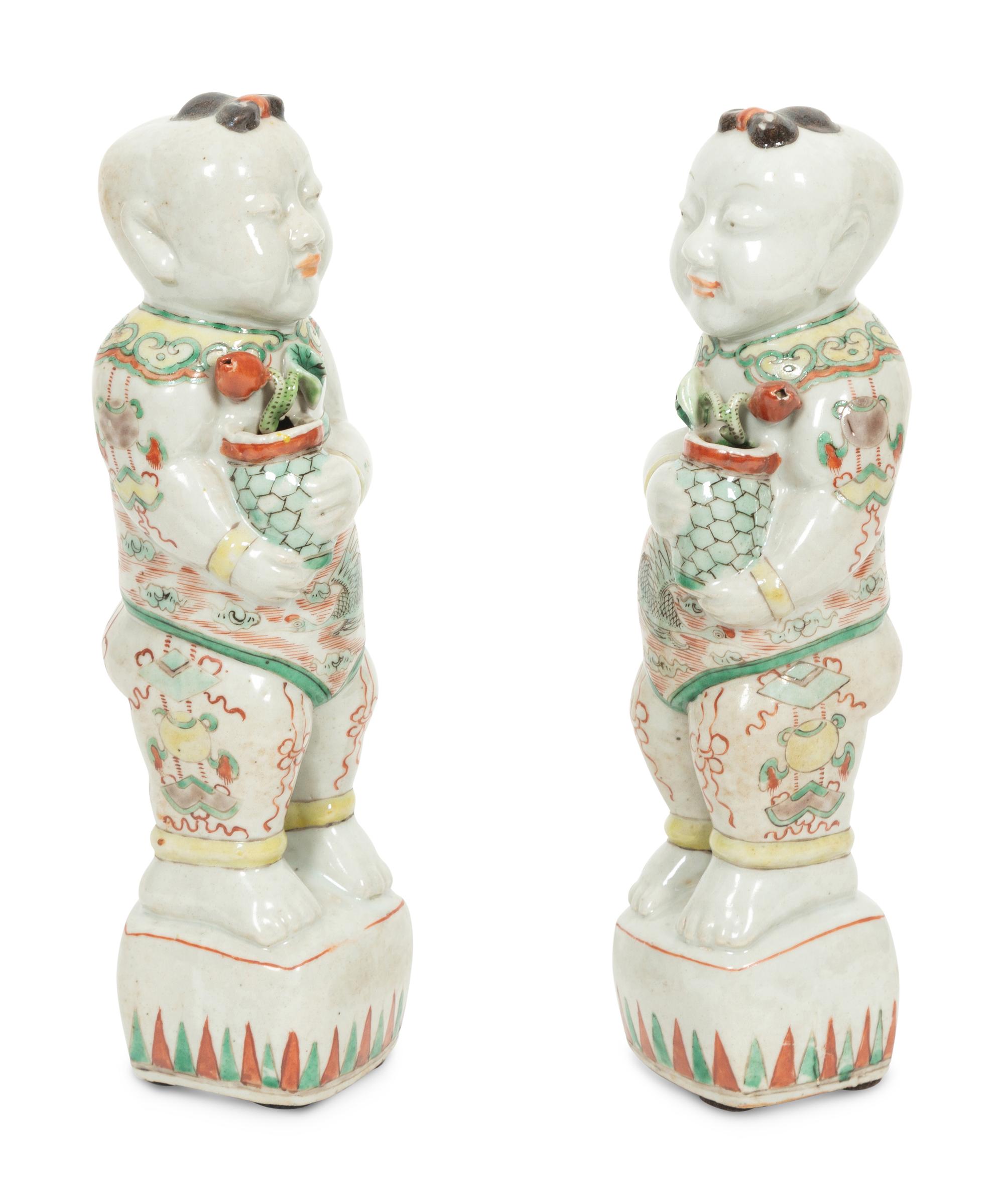 A Pair of Chinese Porcelain Figures of Boys