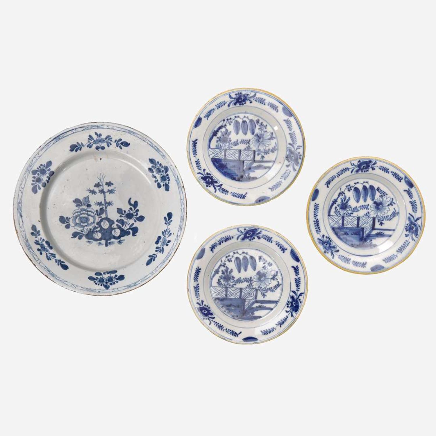 A group of four Delft blue and white "chinoiserie" plates 18th century