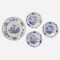 A group of four Delft blue and white "chinoiserie" plates 18th century