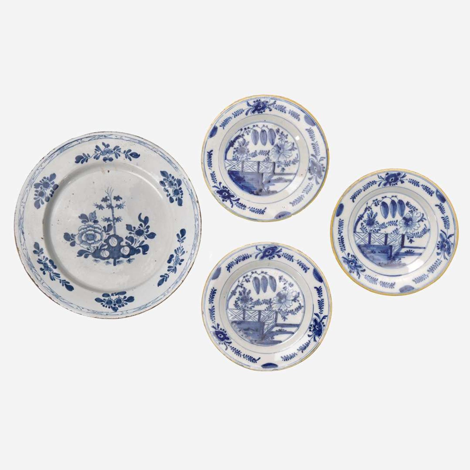 A group of four Delft blue and white "chinoiserie" plates 18th century