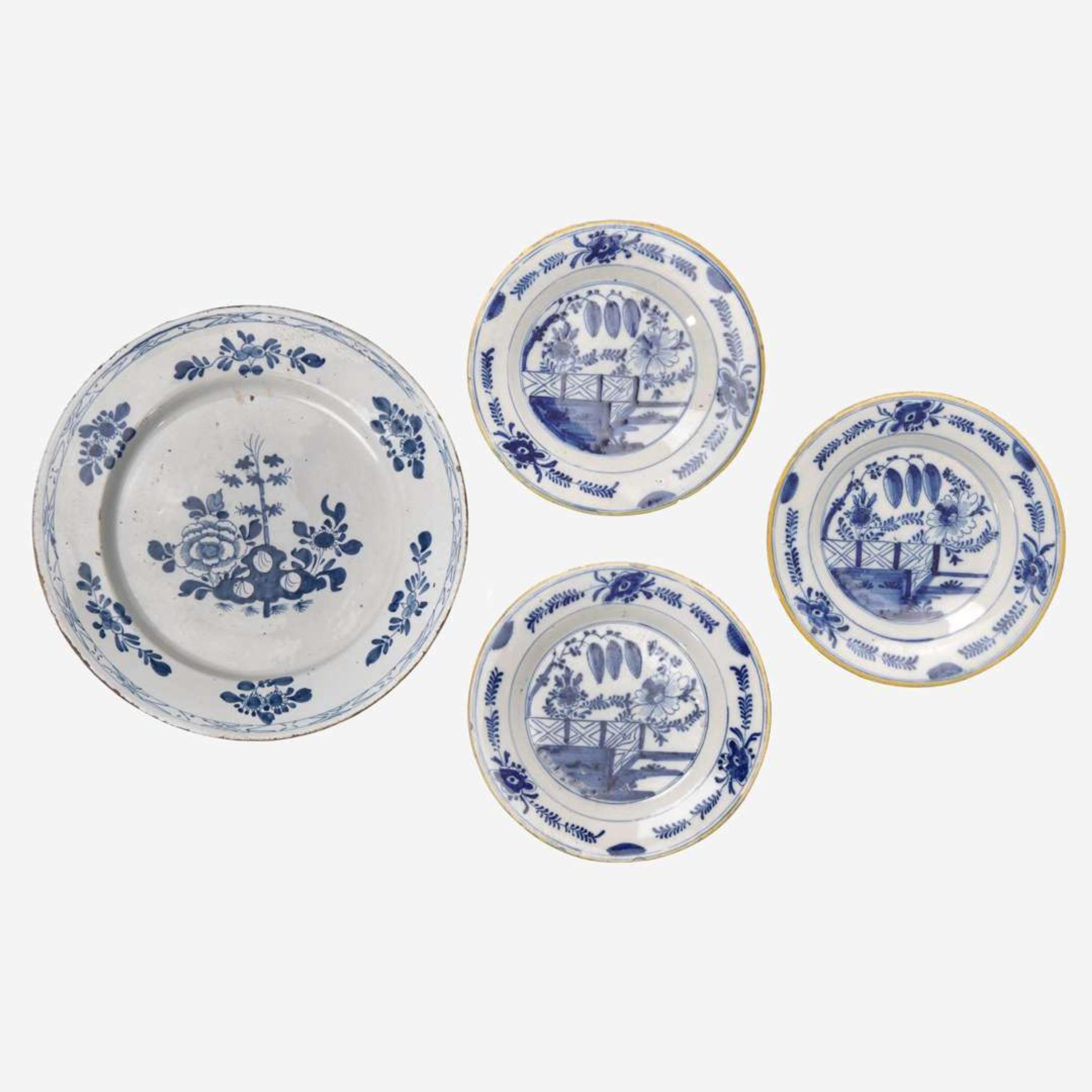 A group of four Delft blue and white "chinoiserie" plates 18th century