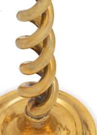 A Group of Four Pairs of English Brass Candlesticks
