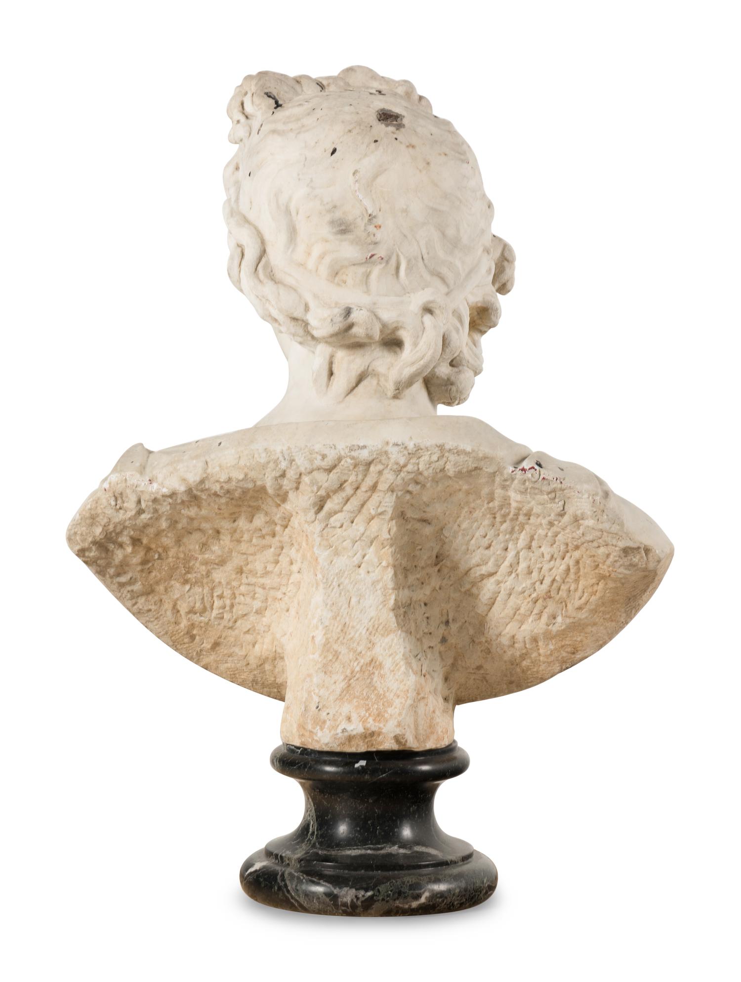 A Continental Carved Marble Bust of the Apollo Belvedere