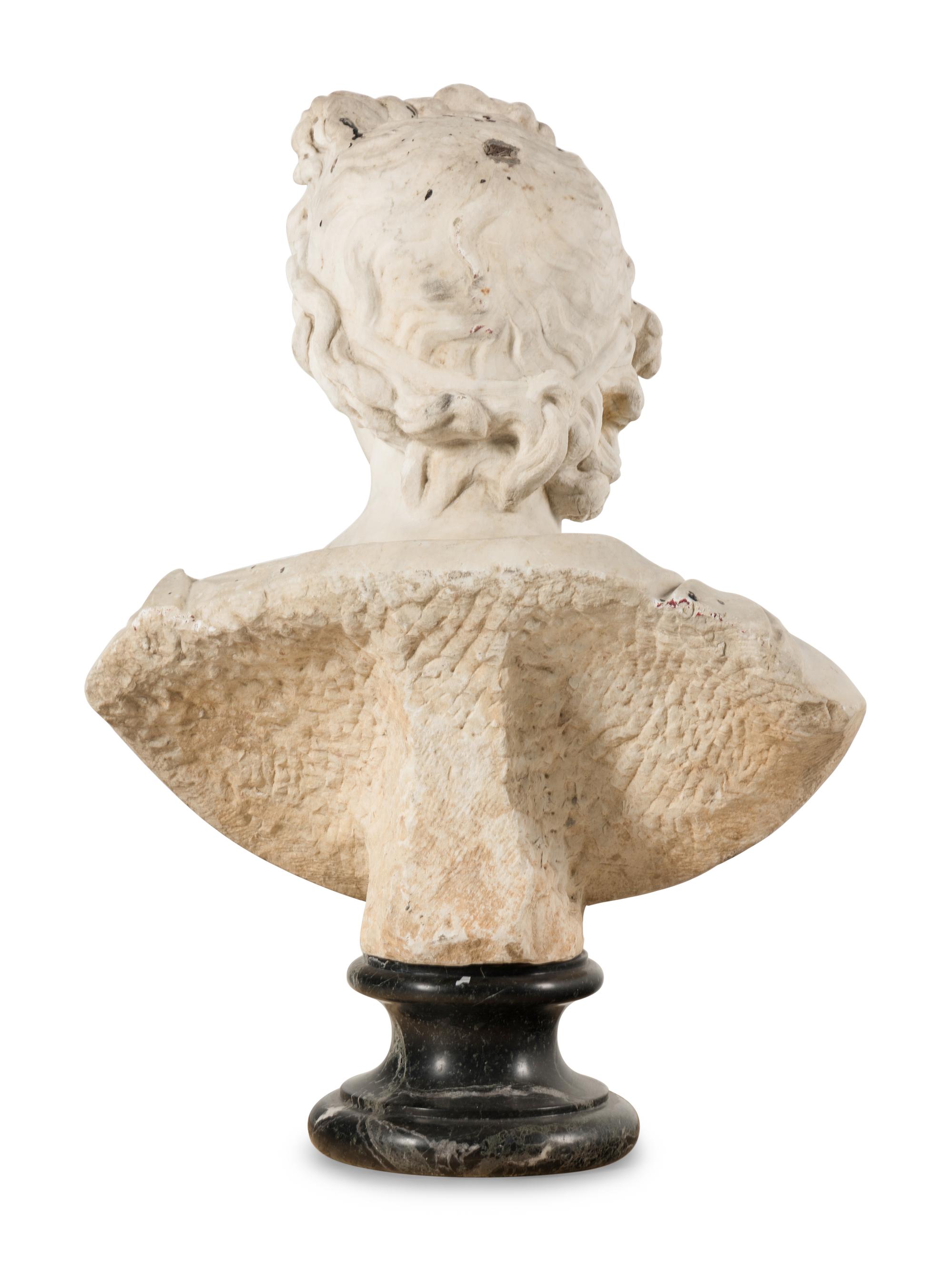 A Continental Carved Marble Bust of the Apollo Belvedere
