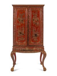A Large Gilt Decorated Red Lacquered Cabinet on Stand