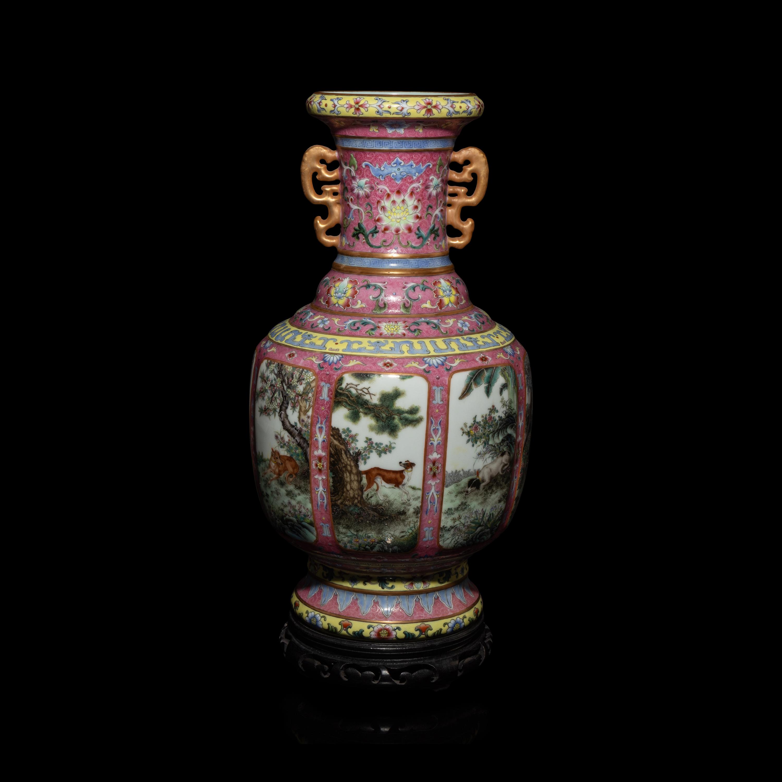 A Chinese Pink Sgraffito Ground Famille Rose Porcelain 'Dogs' Vase, Early-Mid 20th Century — 近現代 胭脂地軋道粉彩纏枝蓮紋開光獵犬圖雙耳瓶 帶木座