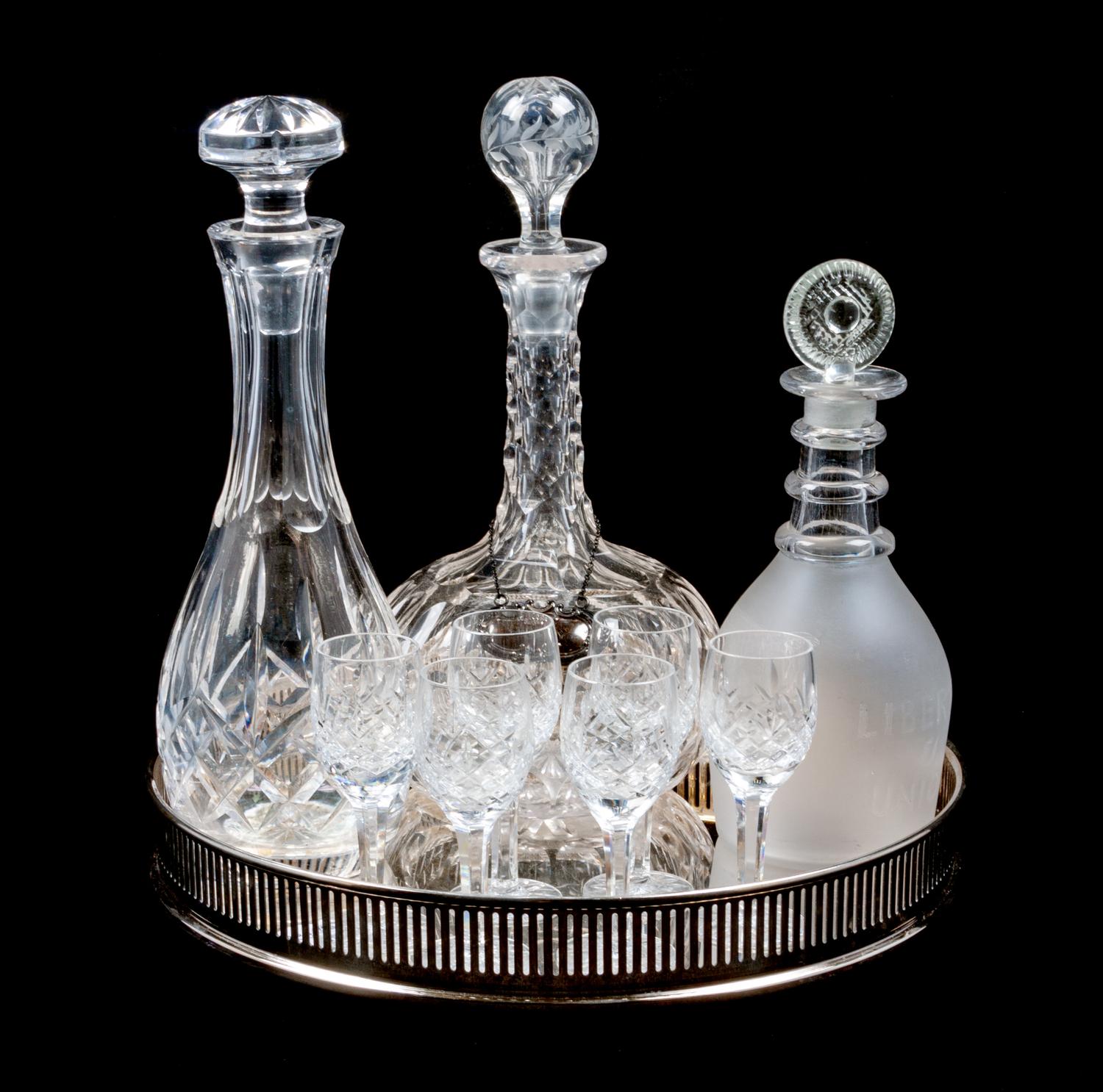 A Group of Three Decanters Height of tallest 11 1/4 inches.