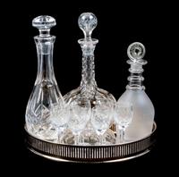 A Group of Three Decanters Height of tallest 11 1/4 inches.