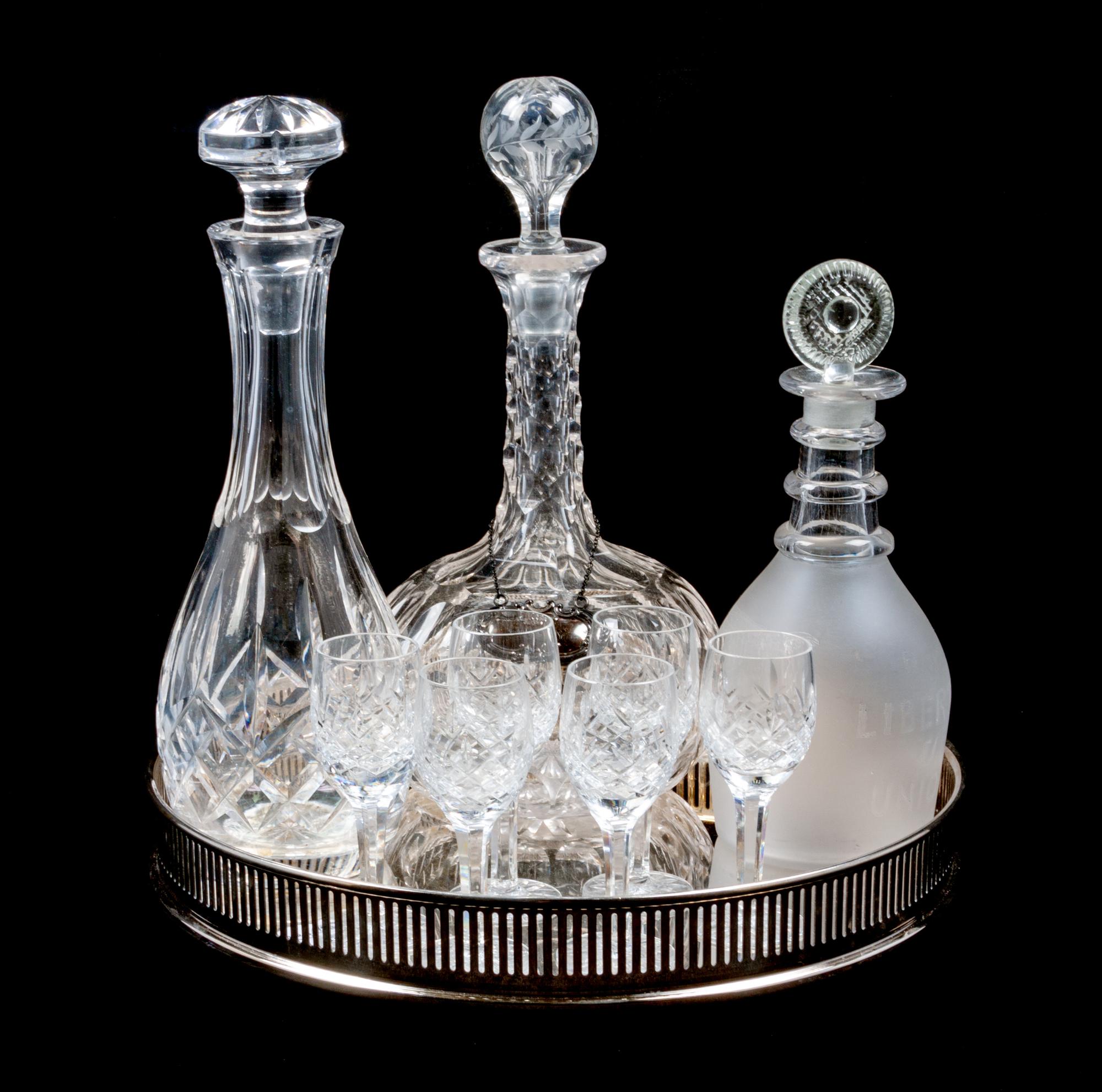 A Group of Three Decanters Height of tallest 11 1/4 inches.