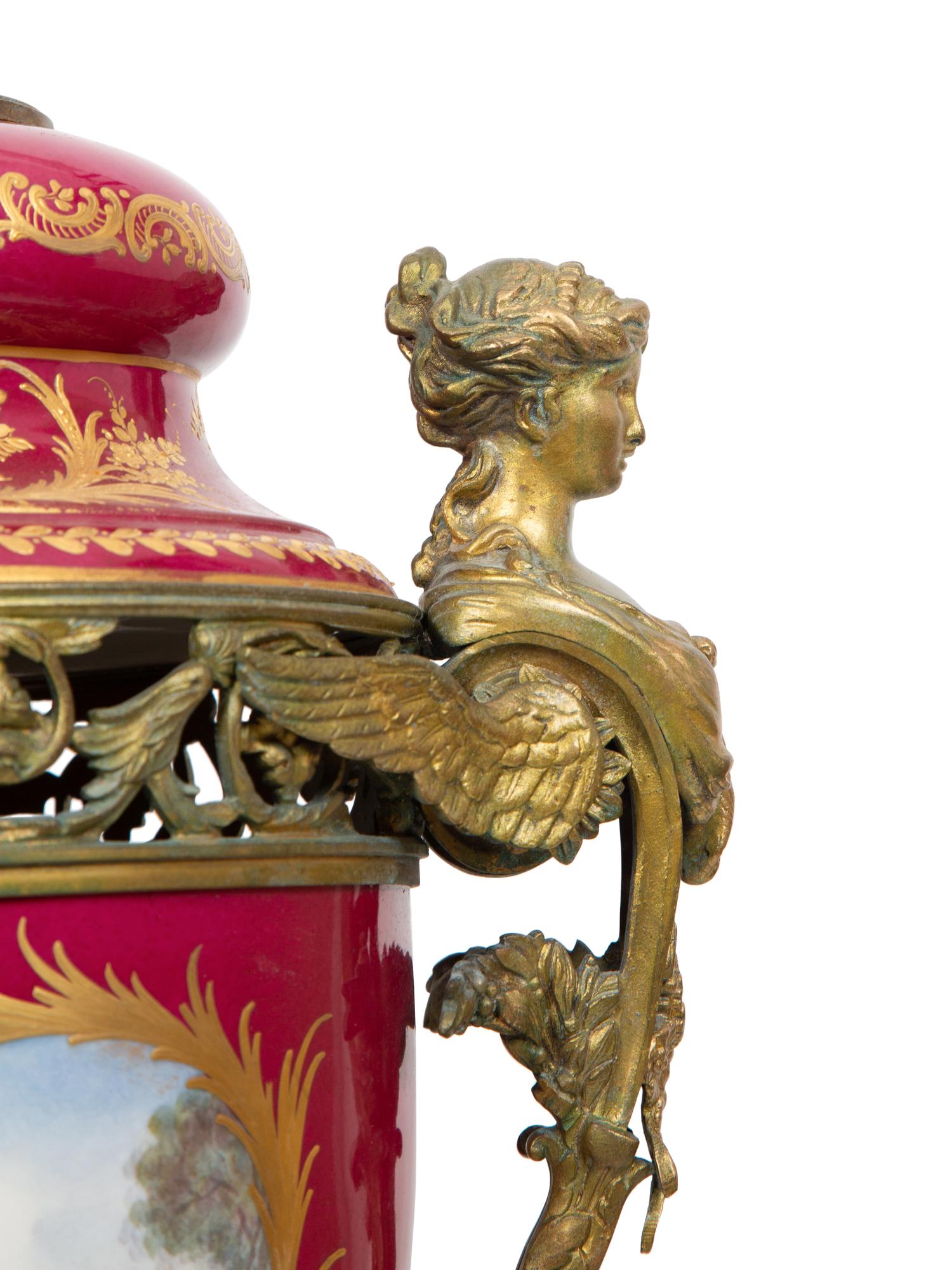 A Pair of Gilt Bronze Mounted Sevres Style Porcelain Covered Urns