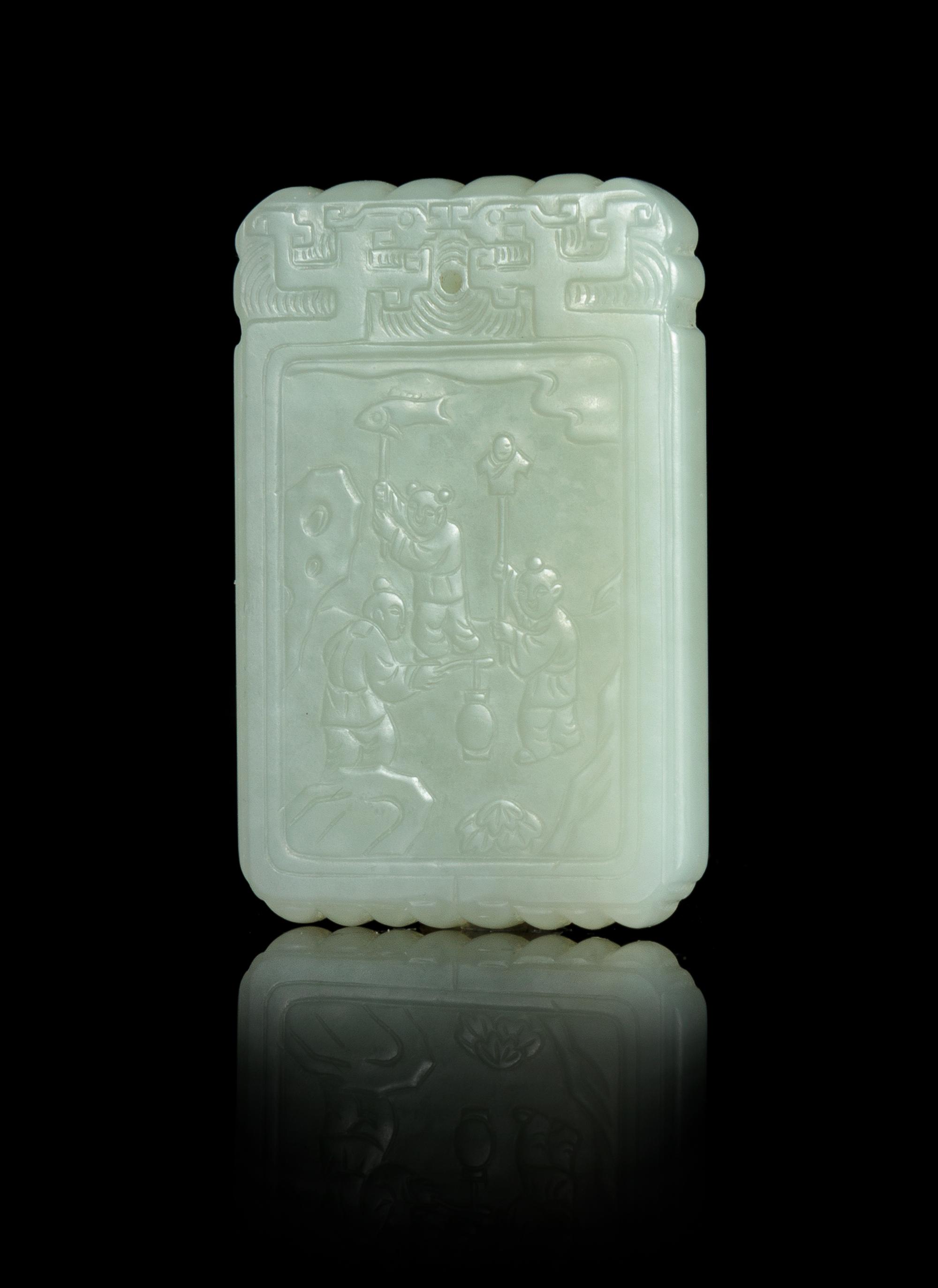 A Celadon Jade Carved Plaque Length 2 3/8 inches.