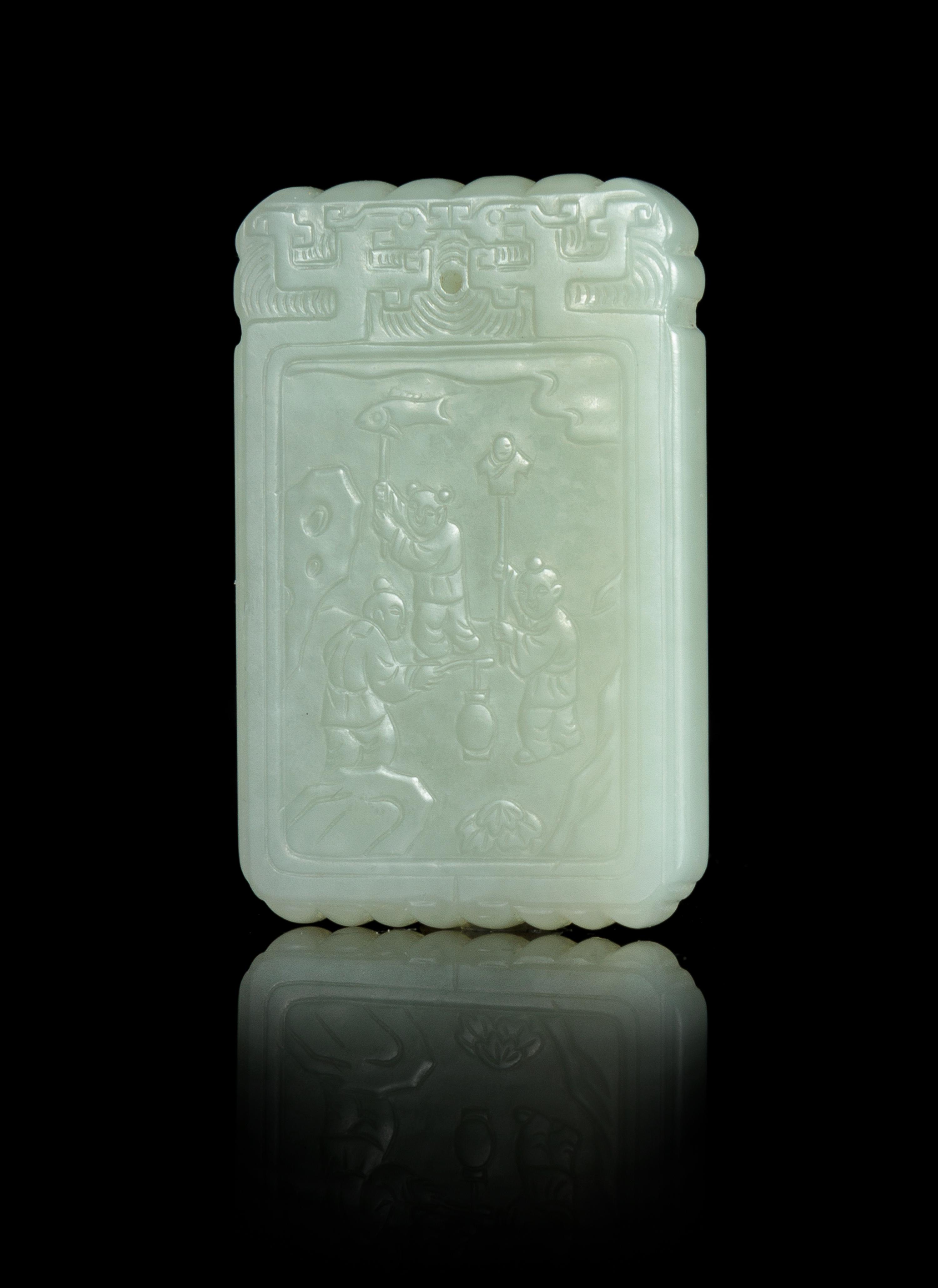A Celadon Jade Carved Plaque Length 2 3/8 inches.